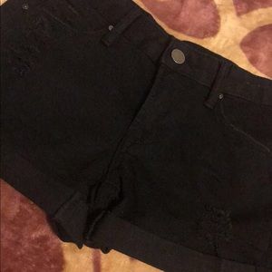 black ripped shorts
